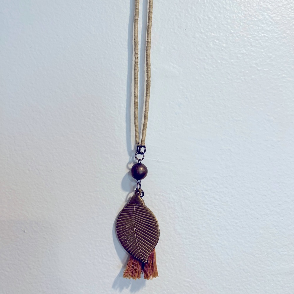Long boho pendant leaf necklace, brass and string.